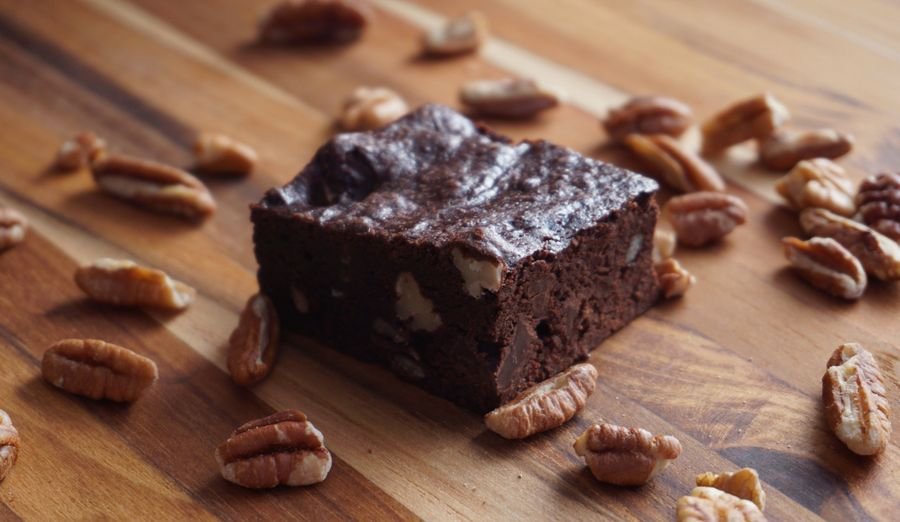A glossy brown butter brownie studded with pecans